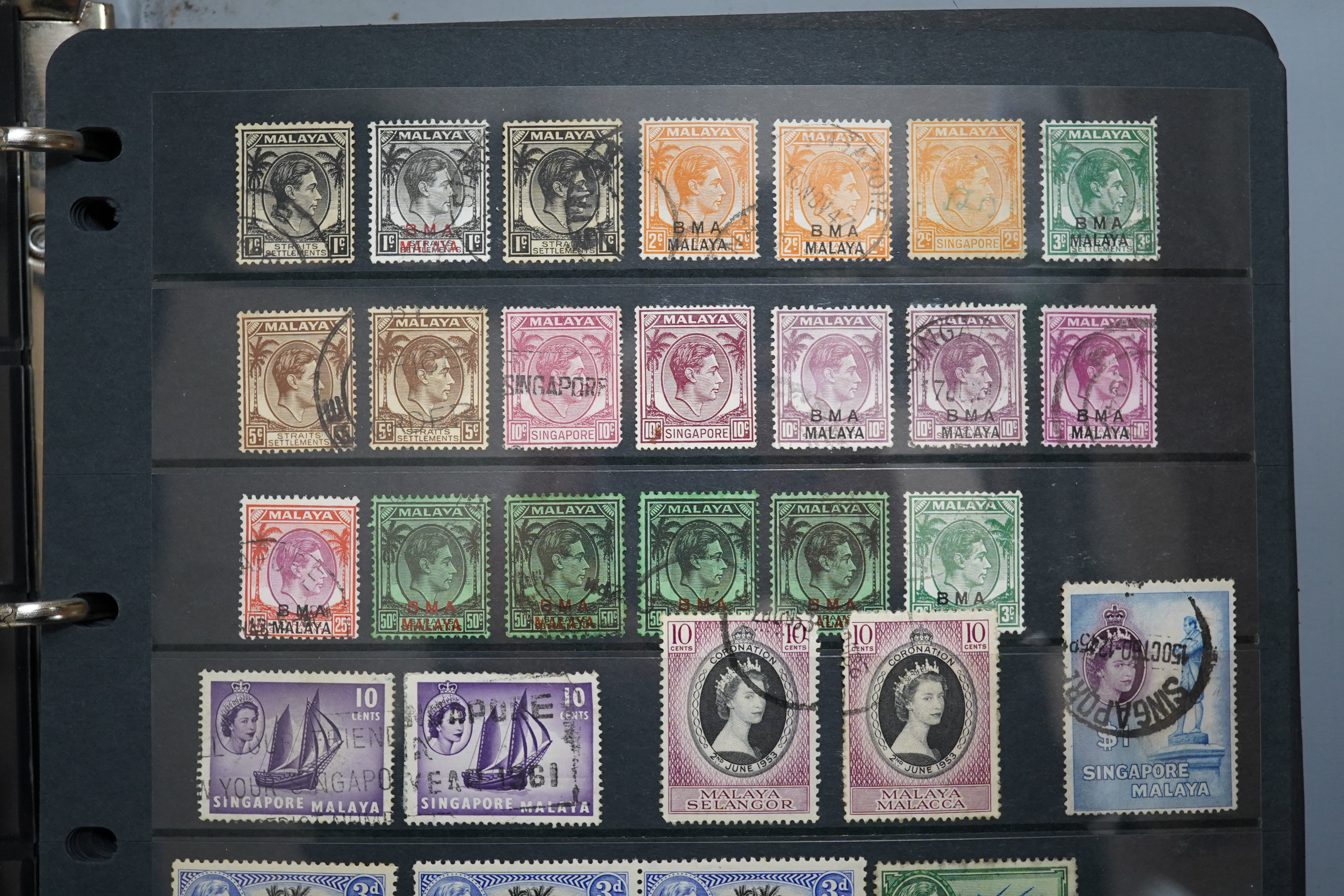 A four albums of mixed stamps, including world and commonwealth, first day covers and an empty album.